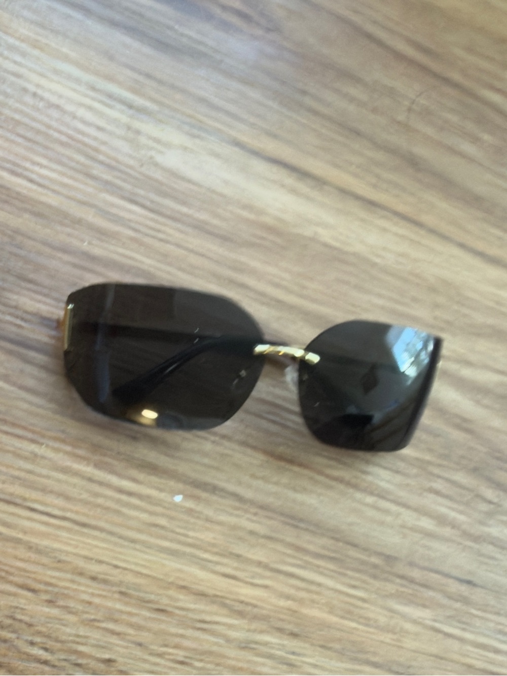 XOXO Rimless Sunglasses with Black Lenses and Gold Bridge